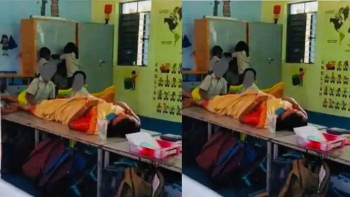 ಟೇಬಲ್ ಮಲಗಿ ಮಕ್ಕಳಿಂದ ಕೈಕಾಲು ಒತ್ತಿಸಿಕೊಂಡು ಶಿಕ್ಷಕಿ : ವಿಡಿಯೋ ವೈರಲ್ ಟೇಬಲ್ ಮಲಗಿ ಮಕ್ಕಳಿಂದ ಕೈಕಾಲು ಒತ್ತಿಸಿಕೊಂಡು ಶಿಕ್ಷಕಿ : ವಿಡಿಯೋ ವೈರಲ್